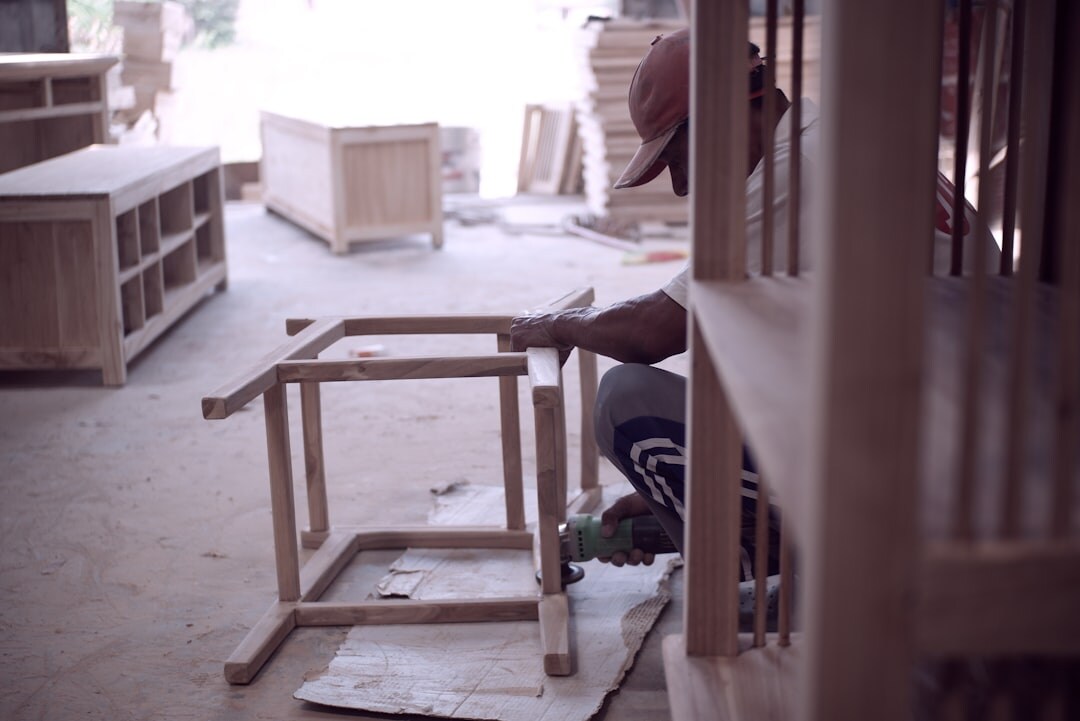 Portrait of a Danish furniture craftsman working in his wooden workshop