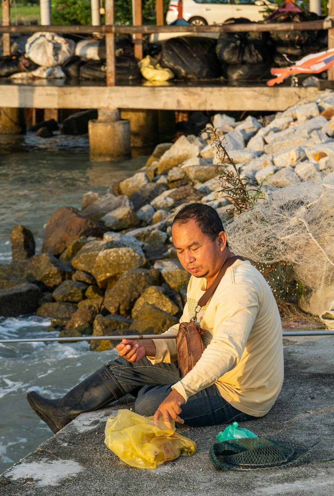 danish fisherman repairing net