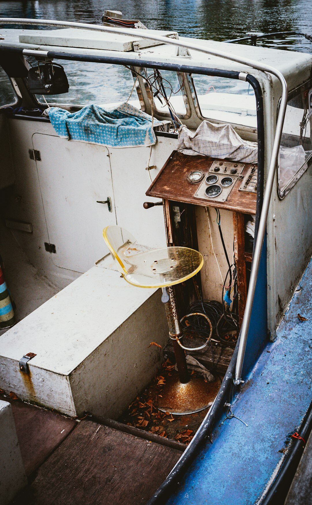 Portrait of a weathered Danish fisherman in his sixties on his boat